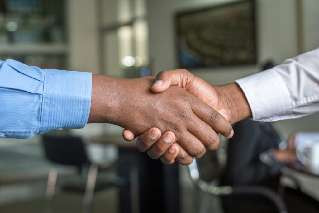 photo by cytonn photography two people shaking hands